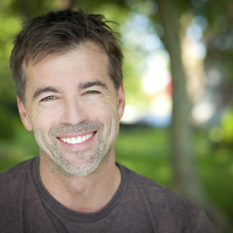 Portrait Of A Man Smiling At The Camera